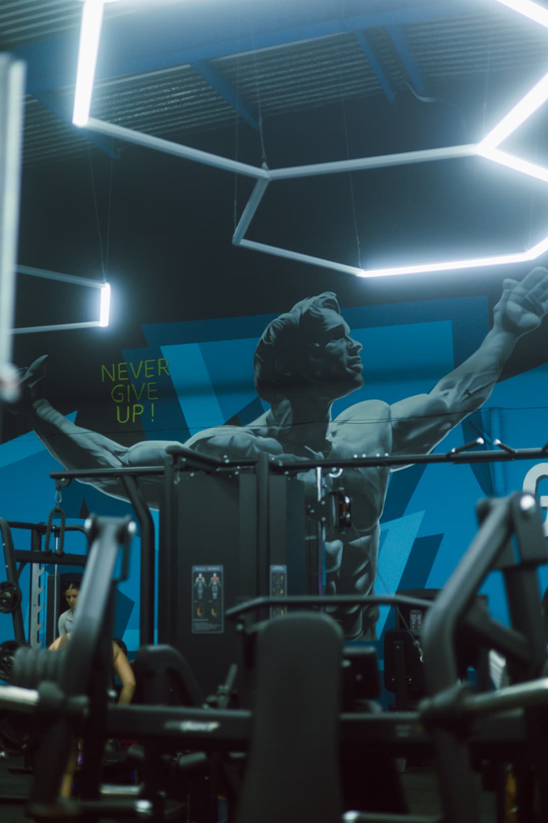 Dark moody gym interior with blue lighting